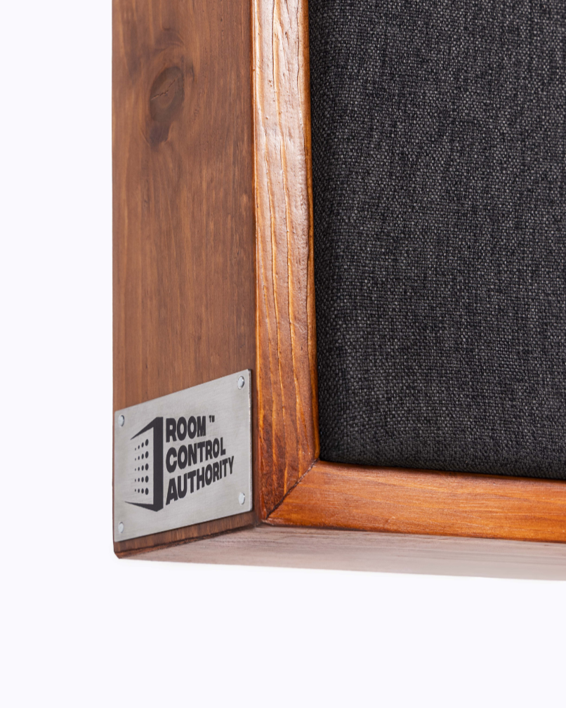 Wooden frame with a textured black panel and 'Room Control Authority' label | Room Control Authority