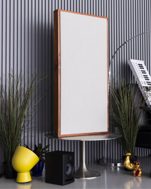 Modern interior design with a tall acoustic panel, speaker, and decorative items against a striped wall | Room Control Authority